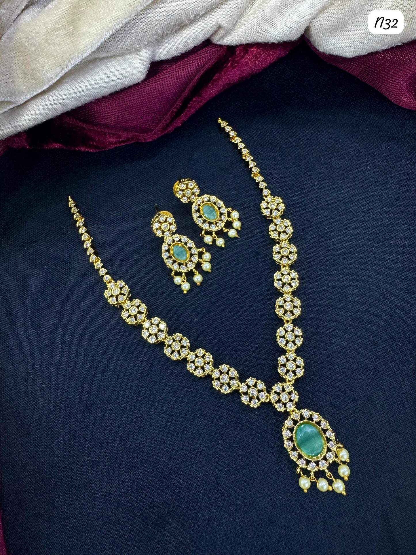 Kundan-Style AD Necklace and Earring Set with Stone and Pearl Detailing