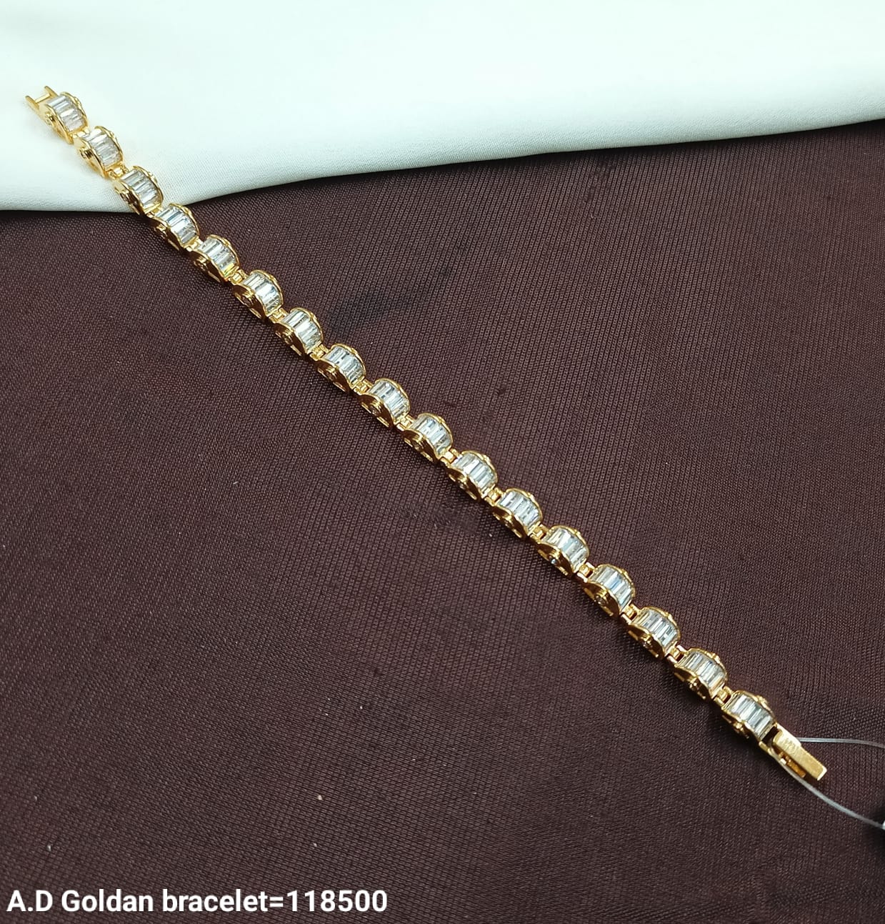 Modern A.D. Golden Bracelet with Baguette-Cut Stones – Sleek & Stylish