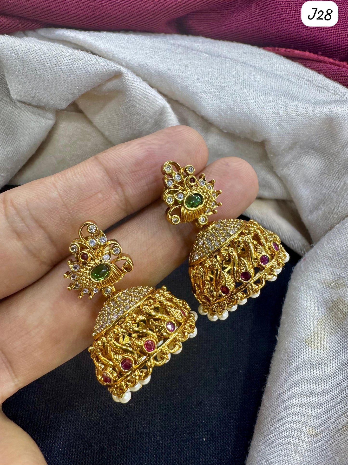 Elegant Gold Jhumka Earrings with Green & Red Ad Stones – Traditional Indian Jewelry