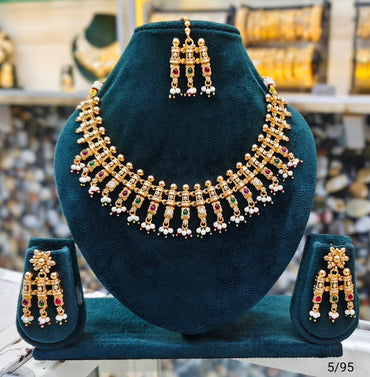 Elegant Traditional Gold Necklace Set with Intricate Detailing and Matching Earrings