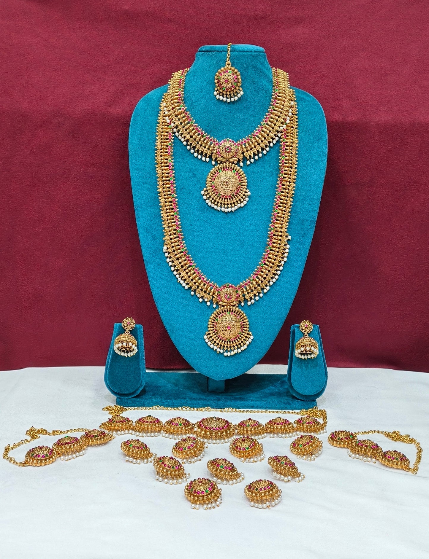 Grand Antique Gold Temple Bridal Jewelry Set (Necklaces, Earrings, Tikka, Vaddanam, Bajuband & Hair Accessories)