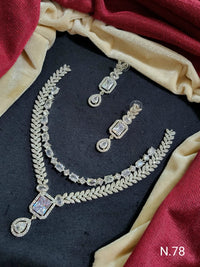 Elegant Leaf Motif Necklace and Earring Set with Gemstone Accents