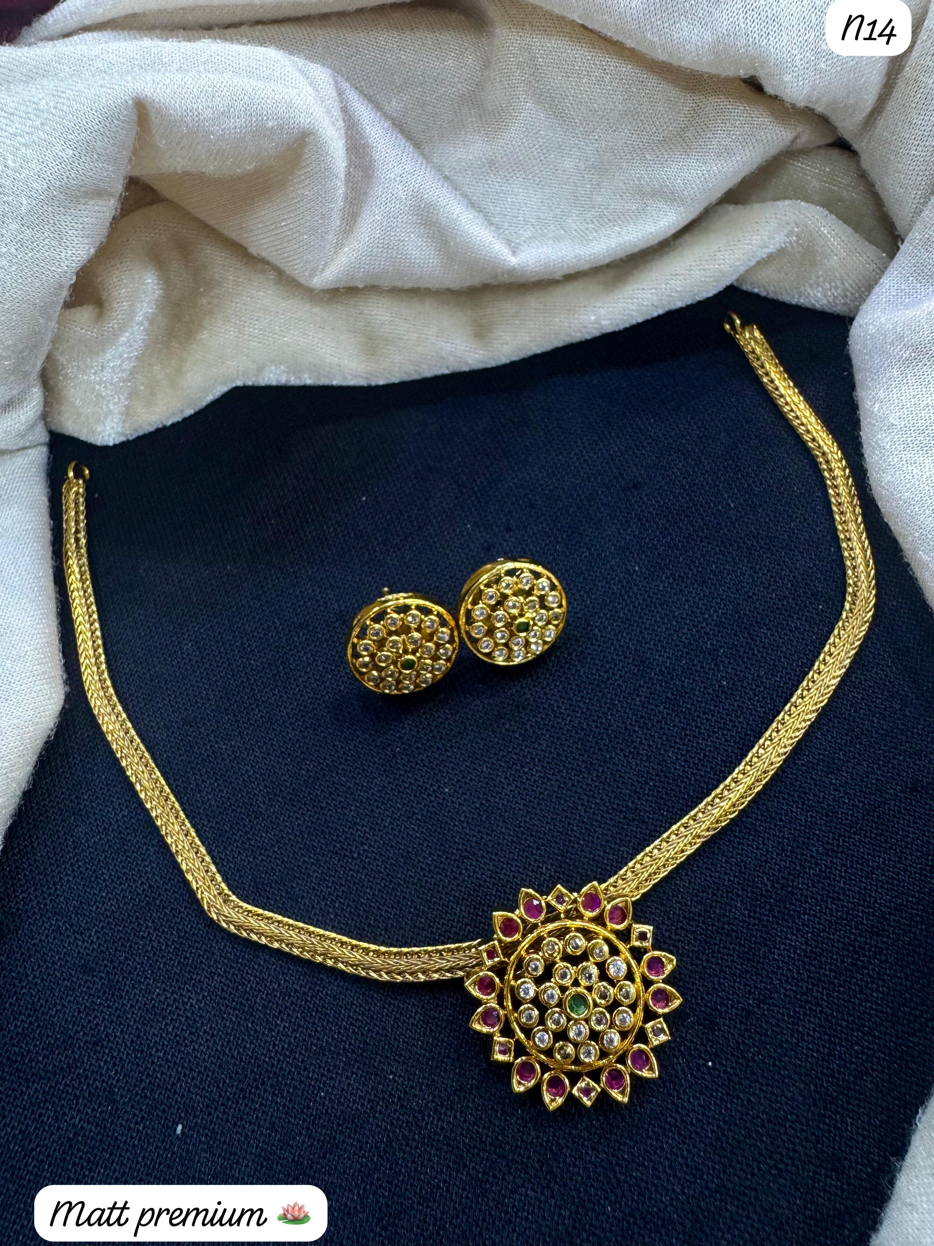Premium Floral Round Pendant Necklace Set – Gold Finish with AD & Ruby-Colored Stones