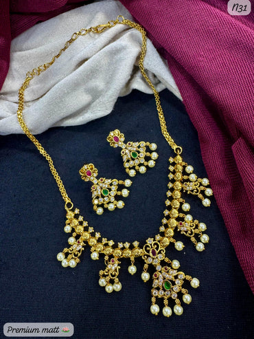 Premium Matte Gold-Plated Peacock Design AD Necklace Set with Pearl Drops & Matching Earrings