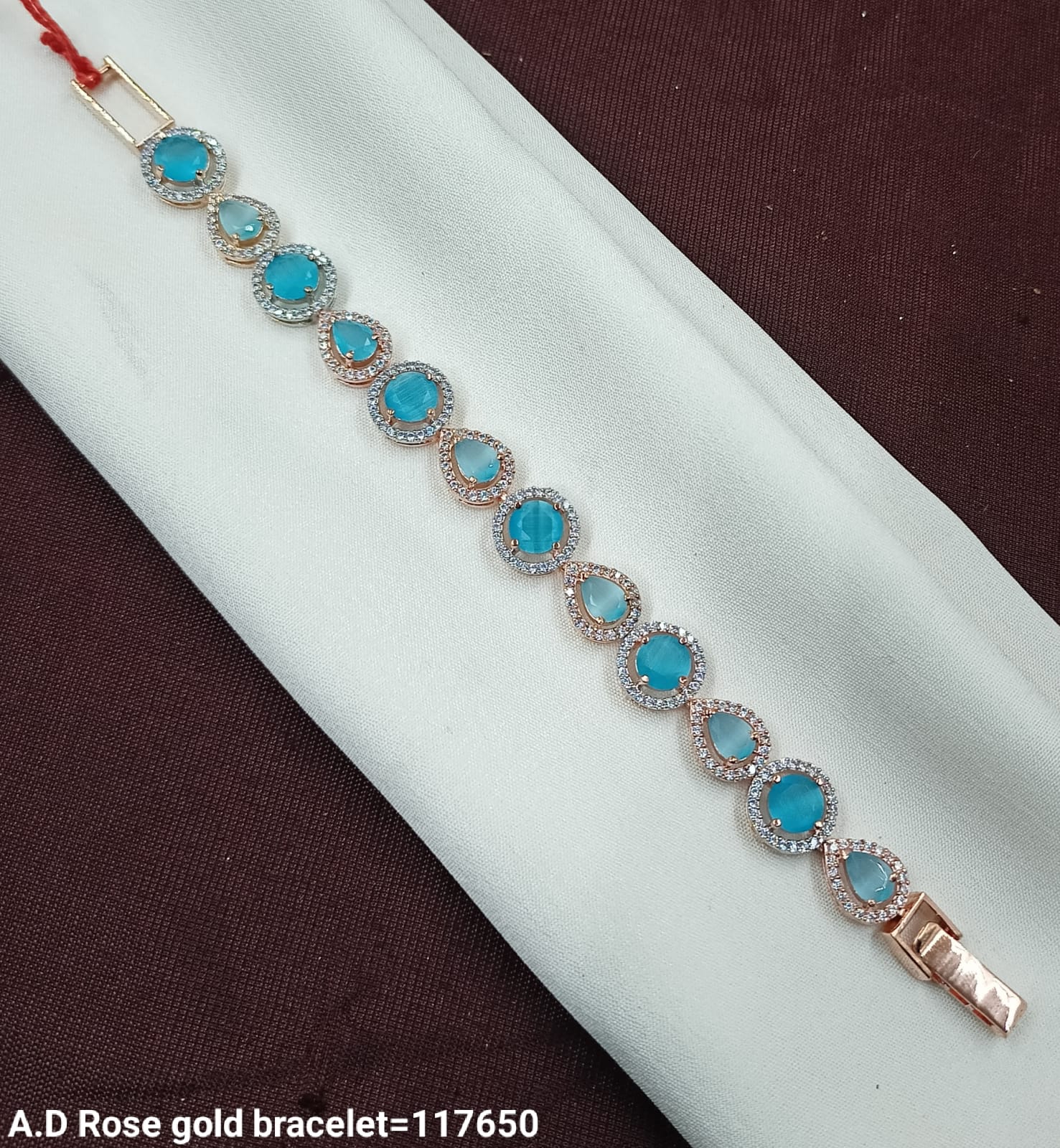 Elegant Rose Gold Bracelet with SkyBlue Stones – AD Design