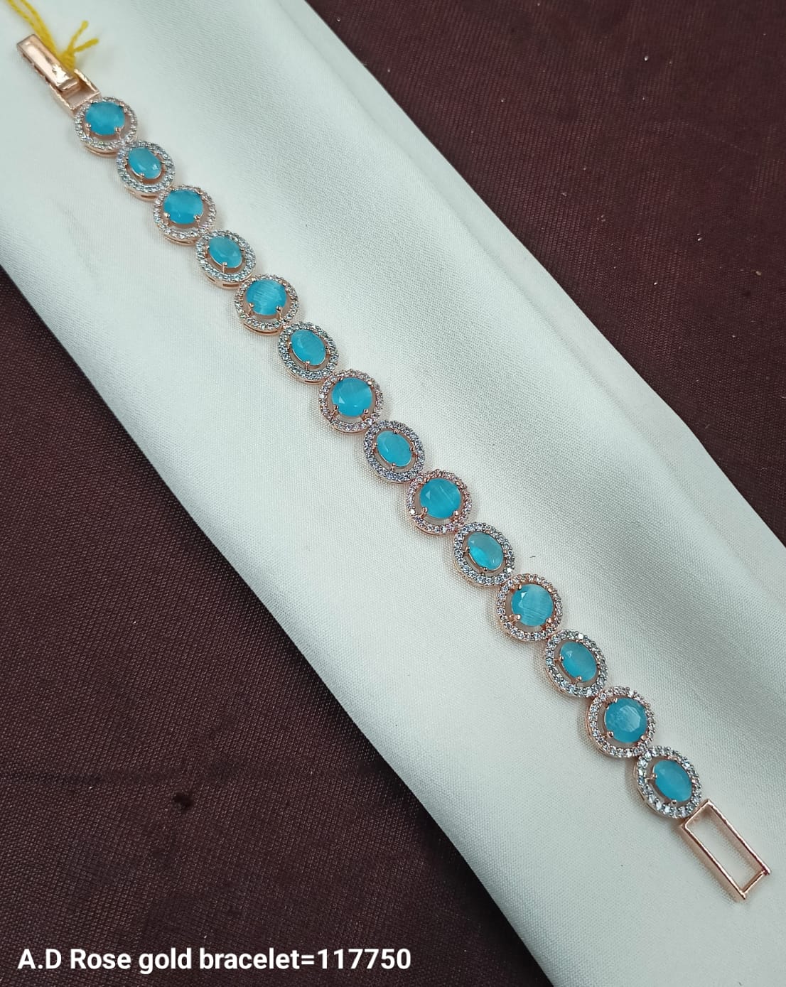 Luxury A.D Rose Gold Bracelet with Oval Blue Gemstones
