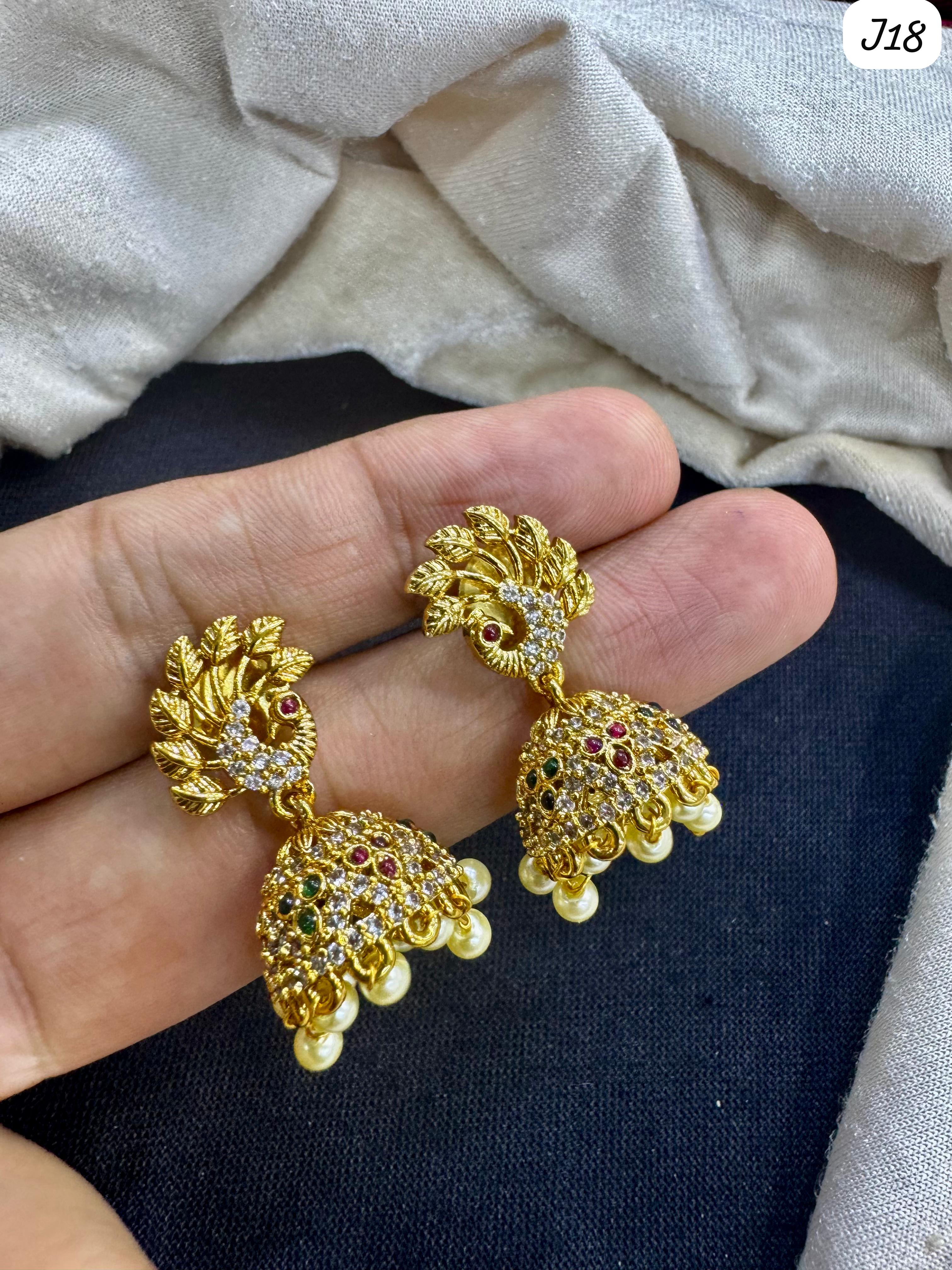 Leaf & Peacock Motif Gold-Plated AD Jhumka Earrings with Multicolor Stone & Pearl Drops