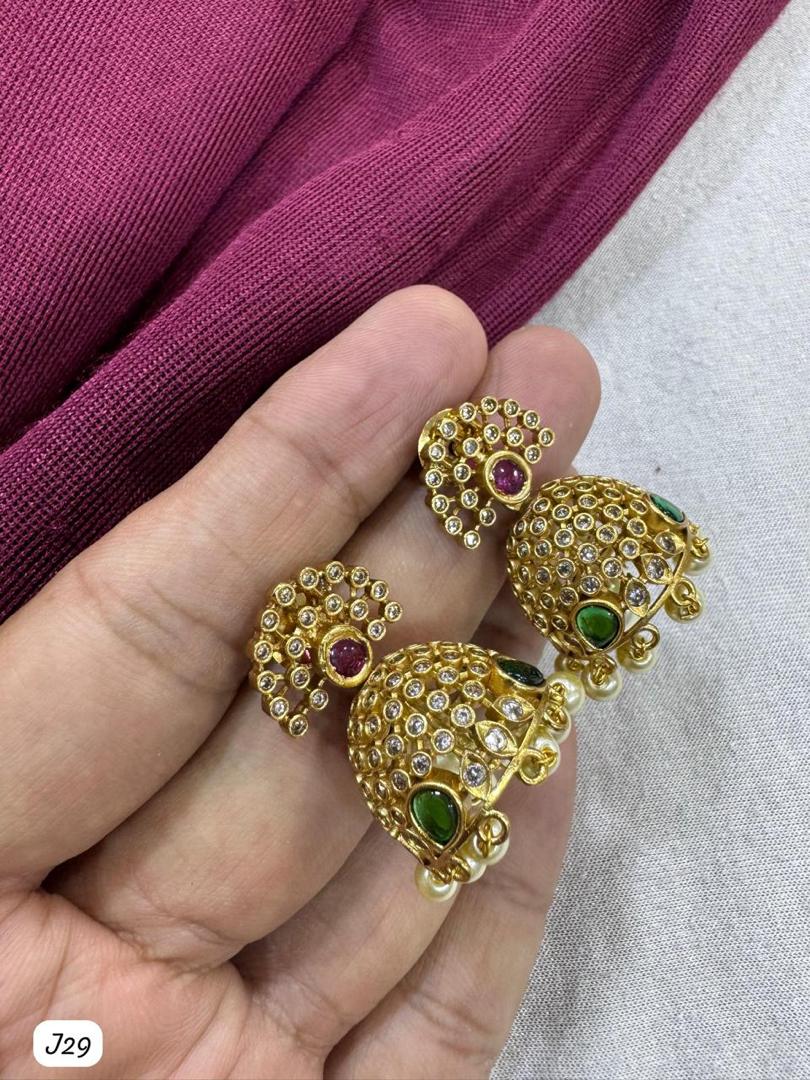Elegant Gold-Plated Jhumka Earrings with Multicolor Stones and Pearl Detailing
