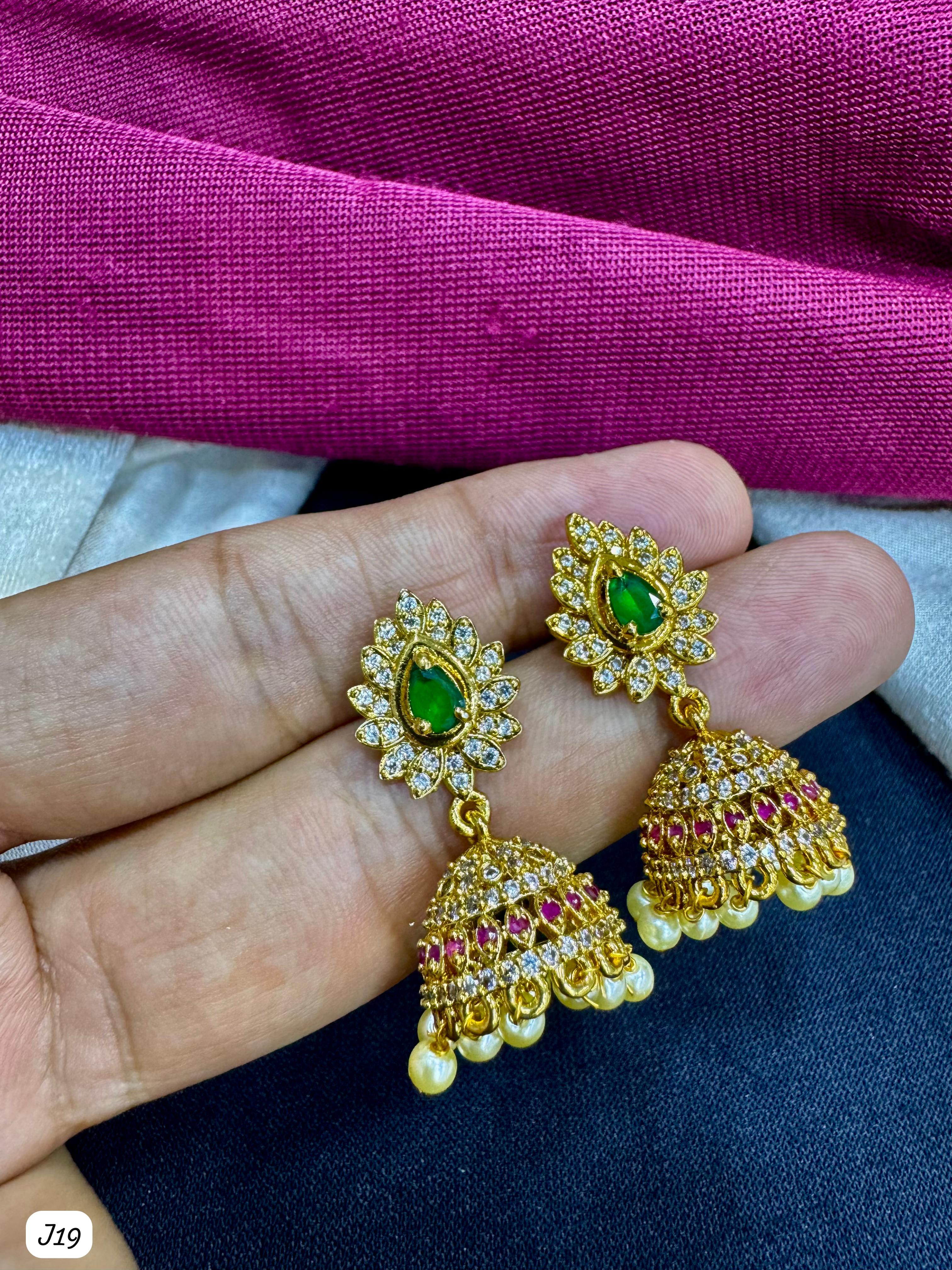 Floral Gold-Plated AD Jhumka Earrings with Green Centerpiece & Pearl Drops