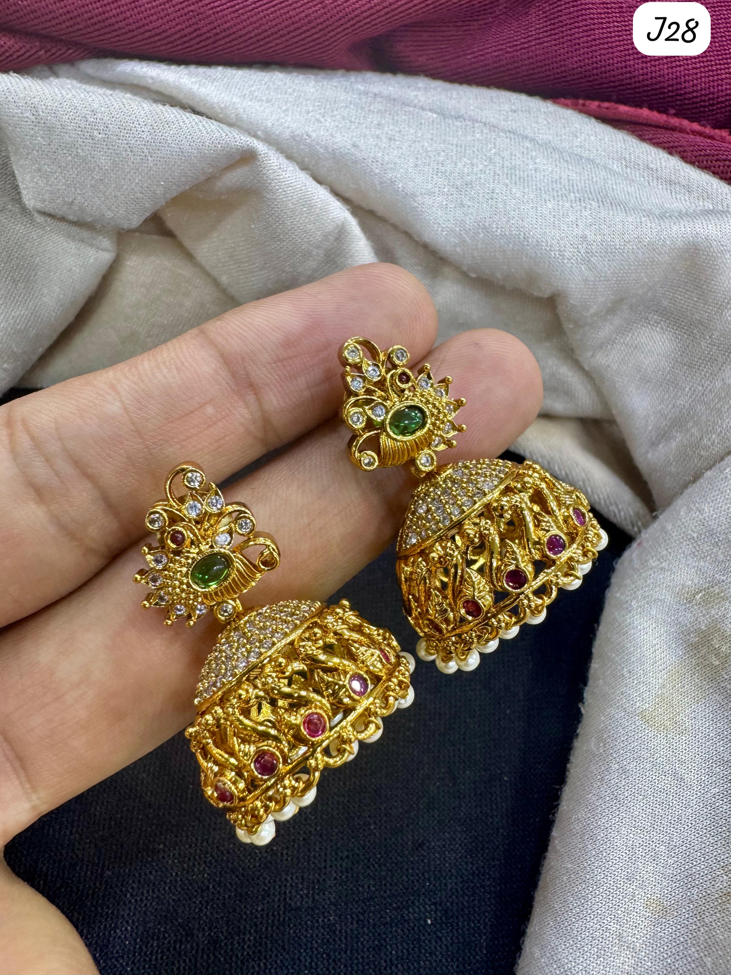 Elegant Gold Jhumka Earrings with Green & Red Ad Stones – Traditional Indian Jewelry