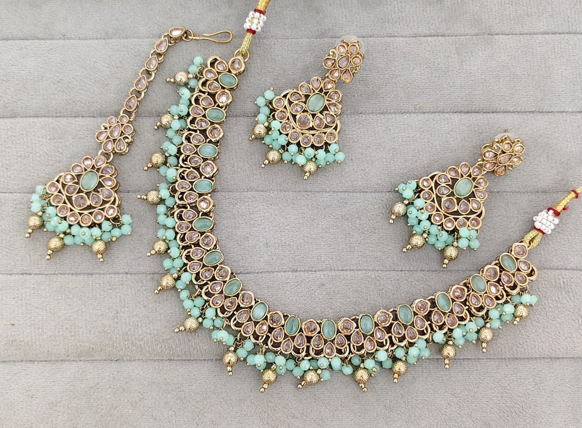 Antique Gold-Tone Stone Studded Jewelry Set with Maangtikka