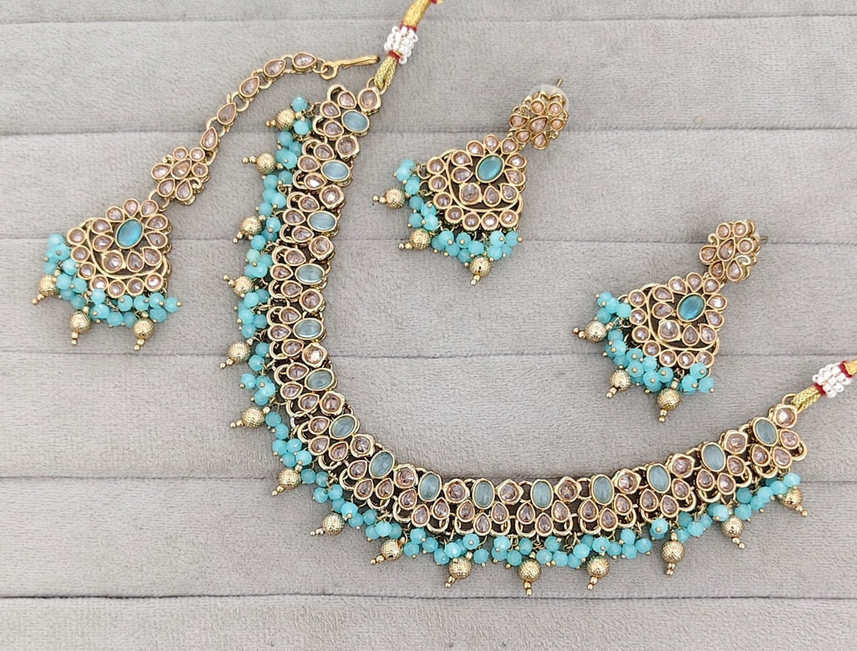 Antique Gold-Tone Stone Studded Jewelry Set with Maangtikka