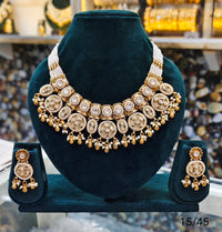 Gold Plated Copper Kundan Necklace Set with Round Motif and Matching Earrings