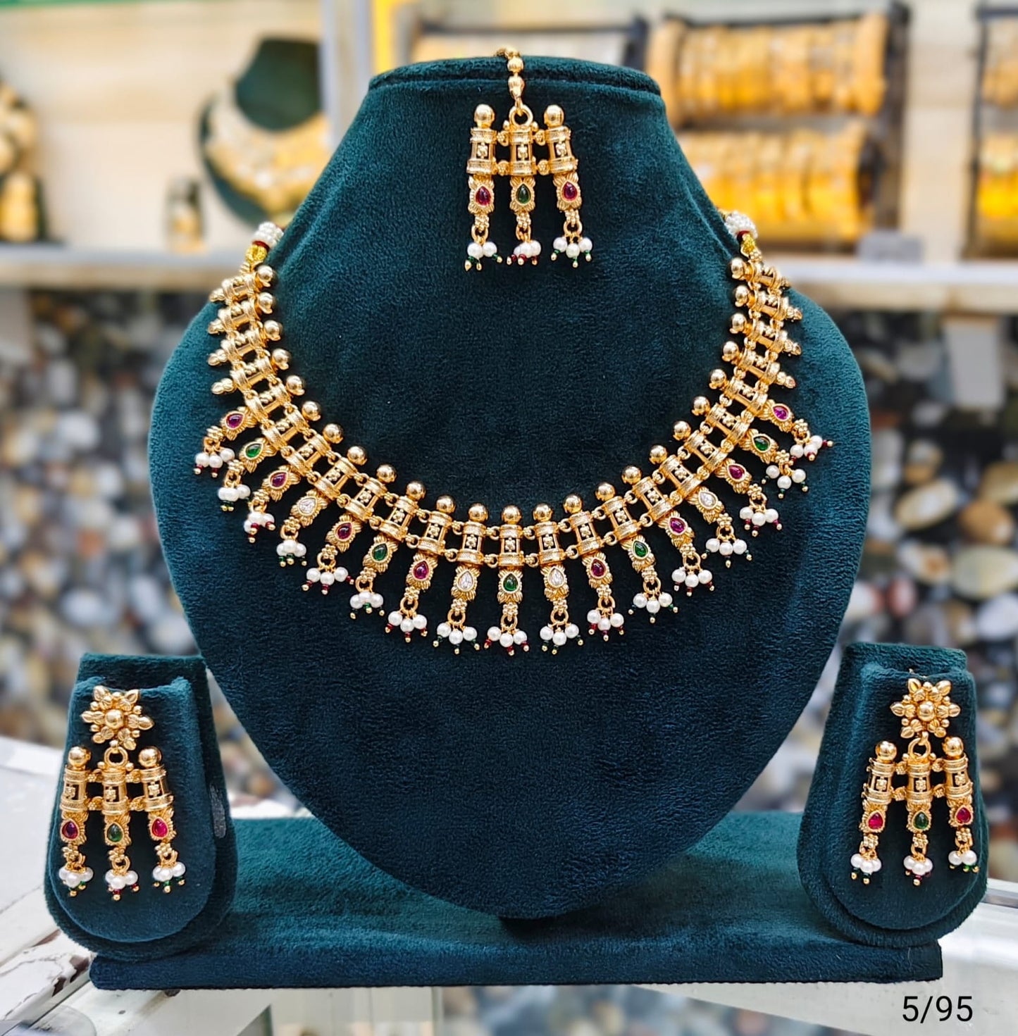 Elegant Traditional Gold Necklace Set with Intricate Detailing and Matching Earrings