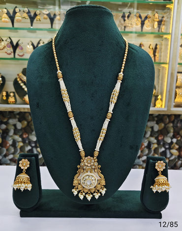 Elegant Traditional Pearl Beaded Necklace with Intricate Pendant and Matching Jhumka Earrings