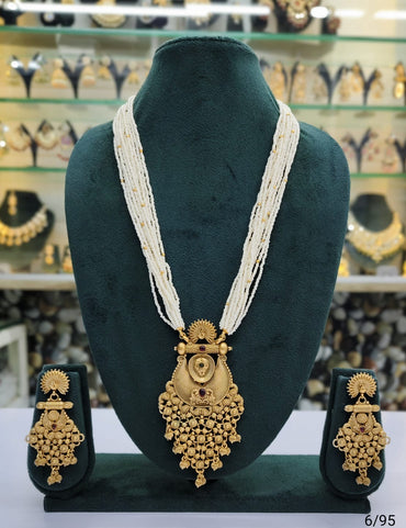Elegant Multi-Strand Pearl Necklace with Intricate Gold Pendant & Matching Earrings Set