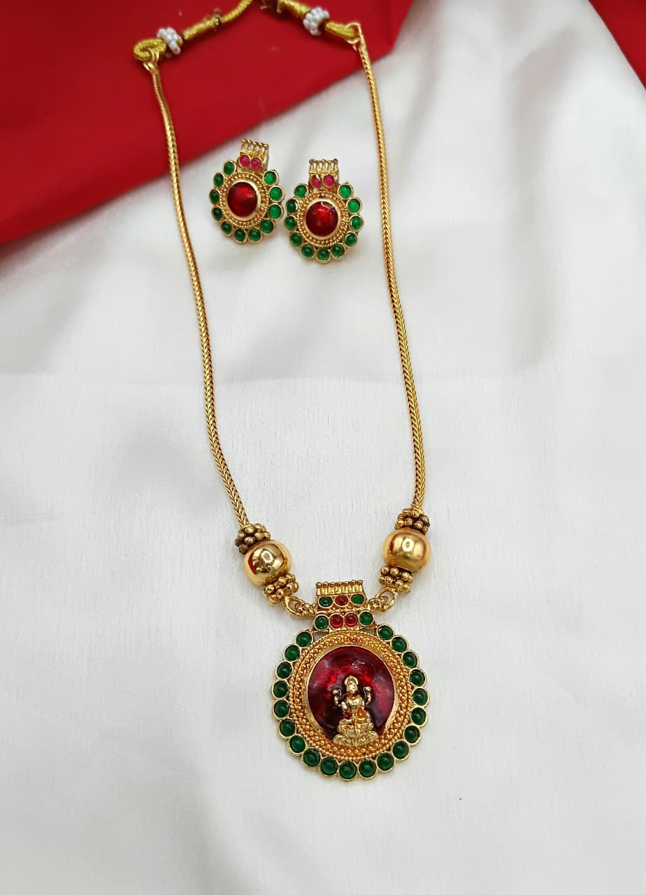 Gold Goddess Lakshmi Pendant with Emerald Green Stones