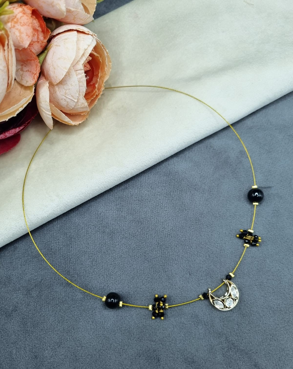 Invisible Wire Crescent Pendant Necklace with Black Bead Accents